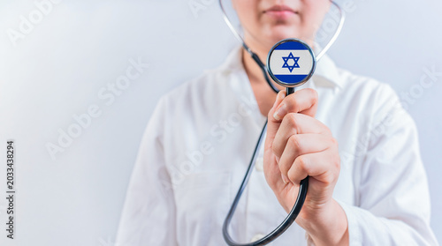 Doctor showing stethoscope with Israel flag. Israel National Healthcare concept