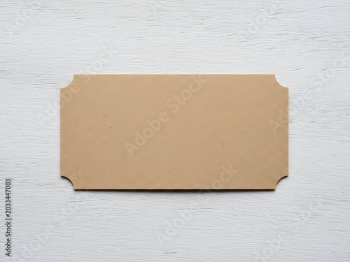Blank Brown Leather Label Tag on White Wooden Background