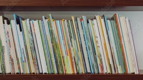 Timelapse Books Filling Wooden Home Library Shelf