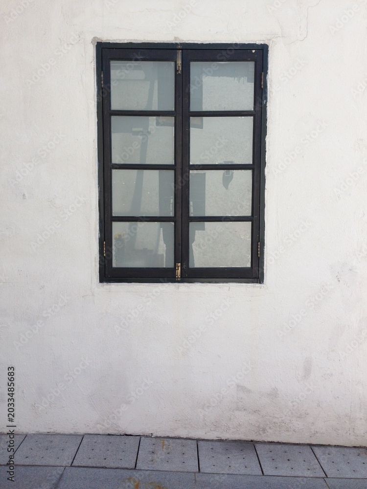 Obraz premium black framed window on white textured wall