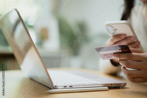 фотографія Buy now pay later concept with smartphone, credit card, and laptop for online shopping, digital payment, and flexible installment finance services