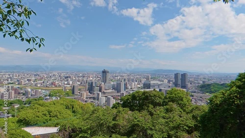 Static high angle view of the cityscape around Kumamoto Station in May 2026