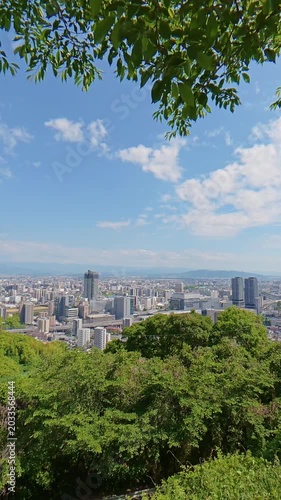Static high angle view of the cityscape around Kumamoto Station in May 2026