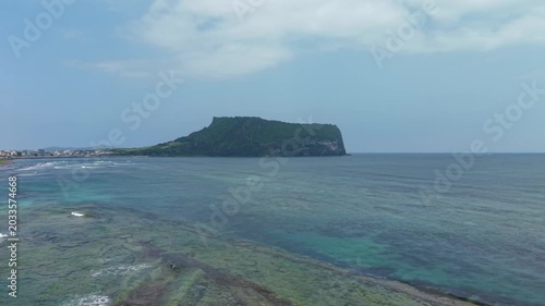 Aerial drone view of Seongsan Ilchulbong in Jeju Island with ocean volcanic landscape and coastal scenery