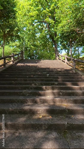 POV shot of walking up a wide outdoor staircase slowly