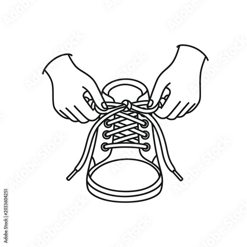 Hands tying shoe laces together.