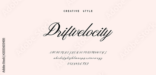 Driftvelocity Creative Style Script Font with Alphabet and Numbers on Dotted Background