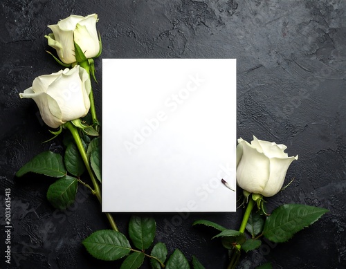 Elegant White Roses Framing Blank Card on Dark Textured Background