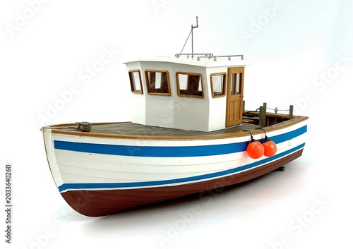 White toy house with blue and brown roof on wooden surface with orange fruit miniature house white house