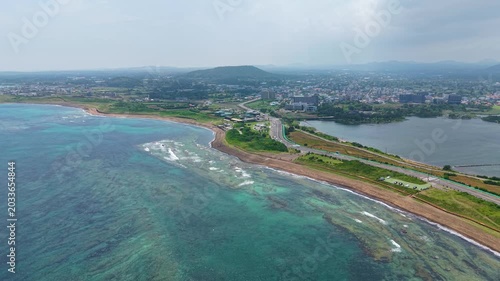 Aerial drone view of Gwangchigi Beach and Seongsan Ilchulbong coastline in Jeju Island South Korea