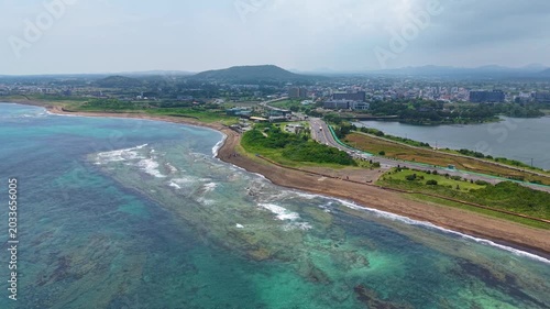 Aerial drone view of Gwangchigi Beach and Seongsan Ilchulbong coastline in Jeju Island South Korea