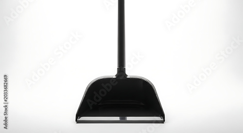 A close up shot of a black dustpan with a long handle on a white background in a studio setting ai generated
