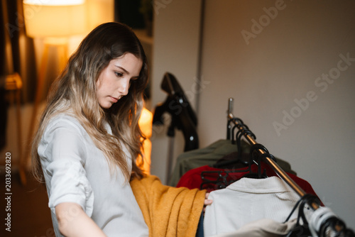 Businesswoman Choosing Outfit for Work at Home