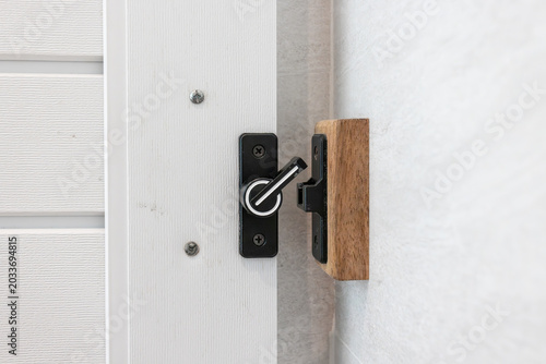 Obraz na plátně The bathroom sliding door latch is unlocked.