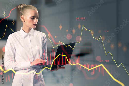 Businesswoman analyzing digital financial charts on laptop. Professional scene with market data overlay. Dynamic corporate background.