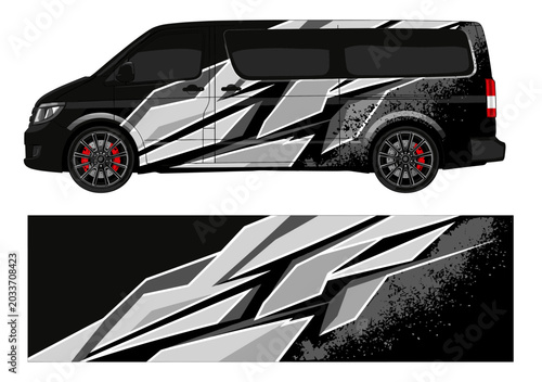 Black van with white and grey grunge style wrap.