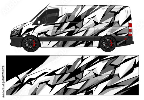 Grey and black polygonal camo van wrap design.