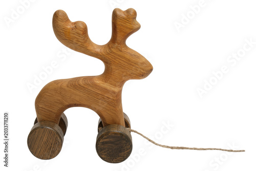 Konstfotografi Wooden reindeer pull toy on wheels isolated on transparent background