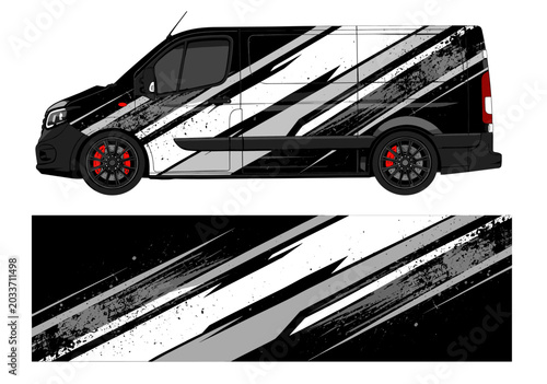 Black van featuring white and grey diagonal racing decals.
