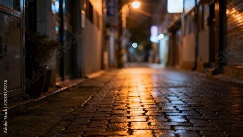 Rainy Night Street with Warm Reflections and Moody City Lights