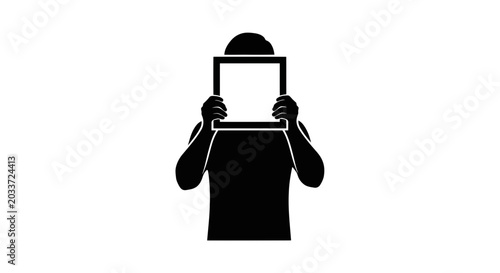 Silhouette of a person holding up a blank frame against a white background, creating a mysterious mood.
