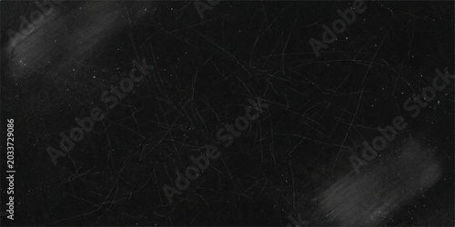 Tableau sur toile A rough, scratchy, and dusty black surface, possibly a chalkboard or a weathered material, with visible smudges and imperfections