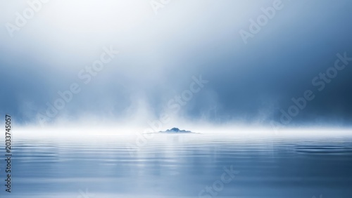 Minimalist island in mist over calm water