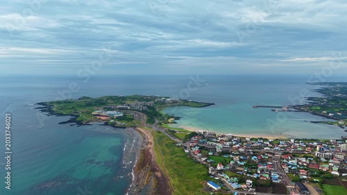 Aerial drone landscape view of Jeju Island countryside village and coastal scenery in South Korea