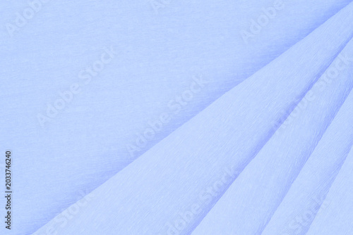 backdrop for message: light blue crepe paper folded several times
