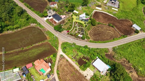 Aerial drone view of Jeju Island rural farmland landscape near Seongsan with beautiful green countryside scenery in South Korea