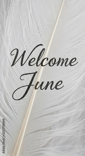 Elegant handwritten welcome message for June on textured paper.