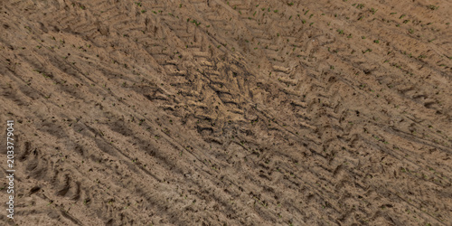 Quadro su tela top view of gravel road surface with tractor tire tracks in countryside
