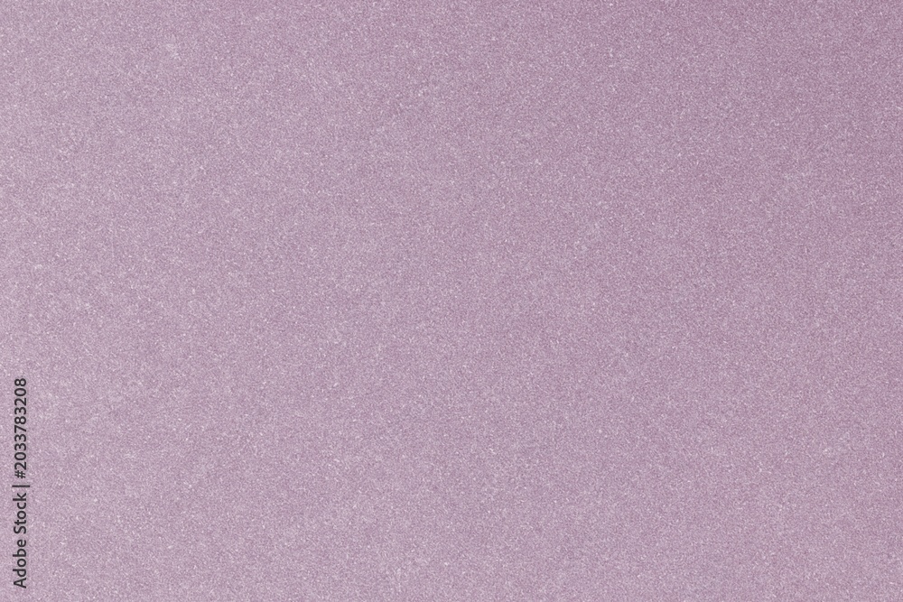 Fototapeta premium Close-up of a textured pink surface with a subtle glitter effect.