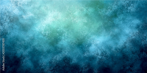 Fotografie Abstract blue and green textured background with light effect in upper part and dark blue in lower part