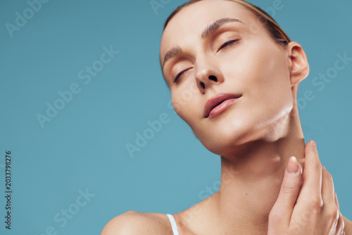 Tableau sur toile Serene closeup portrait of a woman with closed eyes, soft light, and flawless sk