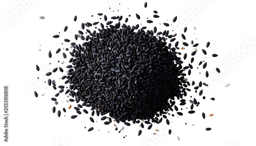 Heap of small, dark-colored, oval seeds against a black background