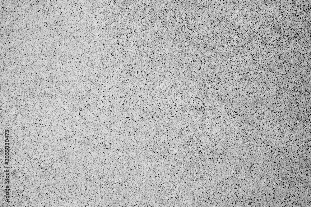 Fototapeta premium Textured background of a rough grey concrete wall surface showing detailed granular speckle texture