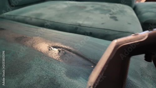 Close Up of Upholstery Cleaning Extraction Vacuum Removing Dirt and Moisture From Fabric Sofa