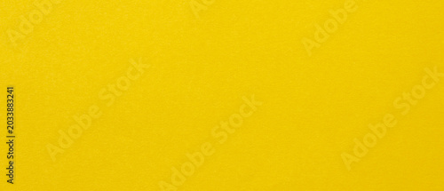 Yellow paper texture background with smooth surface and copy space