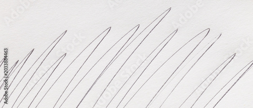 Abstract pencil scribble lines on white textured paper for a creative minimalist background