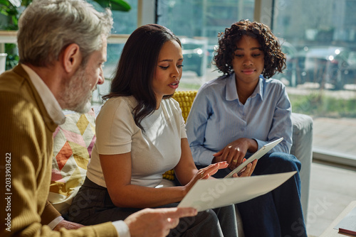 Diverse business team collaborating during meeting in office