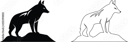 Photos Black and white silhouette and outline of a wolf standing on a rocky outcrop key