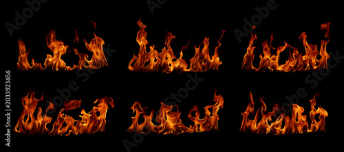Fotografie Realistic blazing fire flames isolated on black background, high detail burning flame collection with glowing orange heat, dramatic fire texture for overlays, danger, energy, hot abstract background