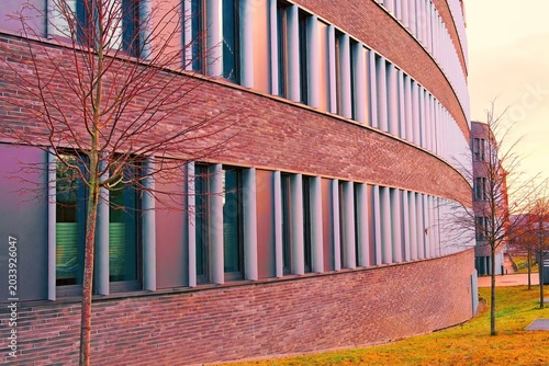 The retro brick stone facade of a modern office building on a cold winter day.