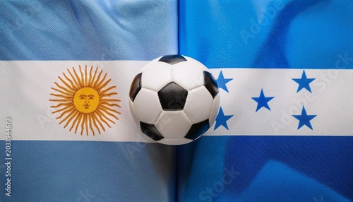 soccer ball between argentina flag and honduras flag