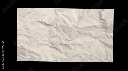 Crumpled white paper unfolds on a black background. Highlighted animation of smoothing white crumpled paper.
