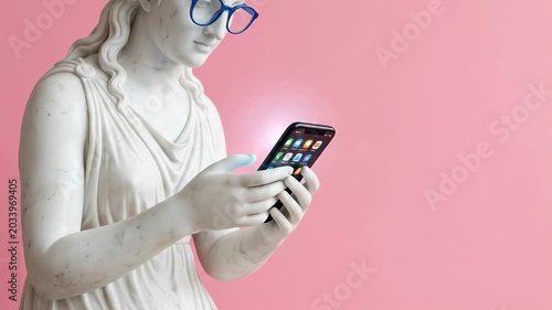 White sculpture of Aphrodite wearing blue glasses looking into a smartphone on a pink background, playful pop culture concept, bold studio styling, surreal art mood, strong copy space, natural light,