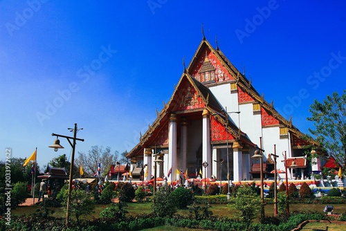 Wihan Phra Mongkhon Bophit Temple in Ayutthaya Thailand - Grand Brick Walkway Under Blue Sky