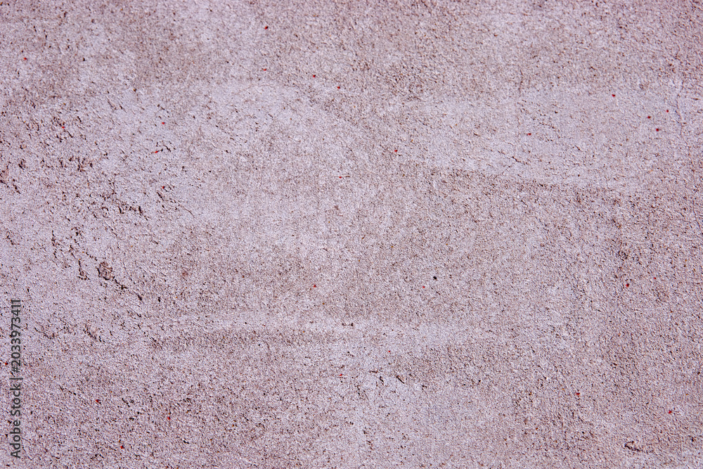 Fototapeta premium Textured concrete surface with subtle variations and light color tones