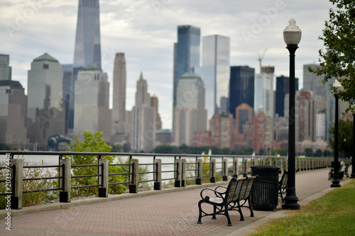 Silent City Reflection. Tranquil Riverside Scene With Skyline And Ornate Railing new york